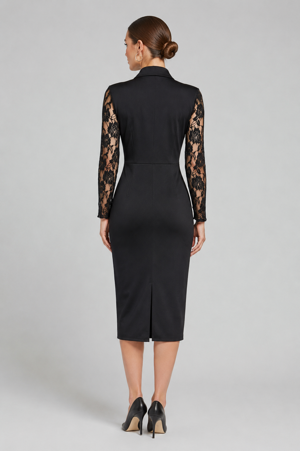 Black dress with lace sleeves worn by a model on a gray background