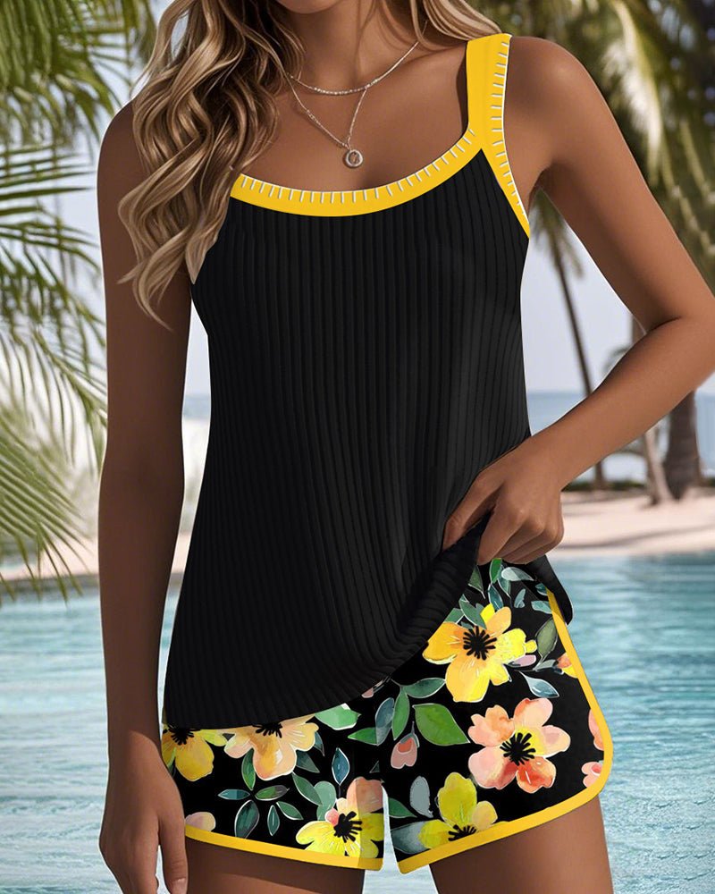 Women's orange tummy control tankini set with floral print shorts