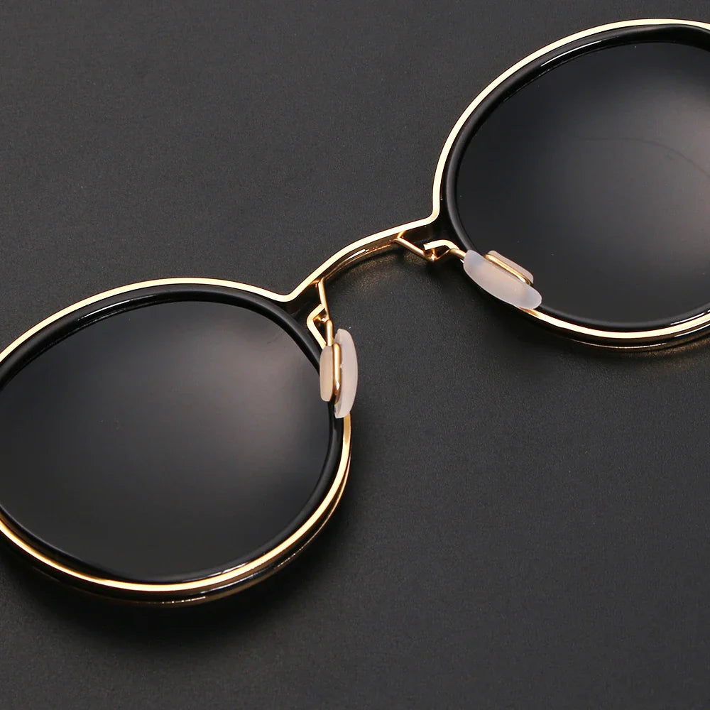 round metal-frame sunglasses with dark lenses