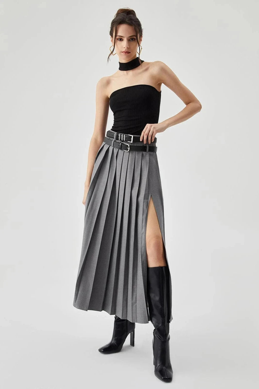 Women's gold pleated maxi skirt with a side split