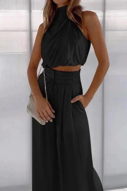Women's black two piece co-ord set with a v-neck top and wide-leg trousers