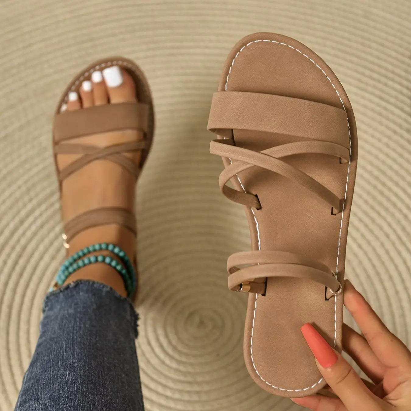 Women's black strappy flat sandals with elastic cross straps