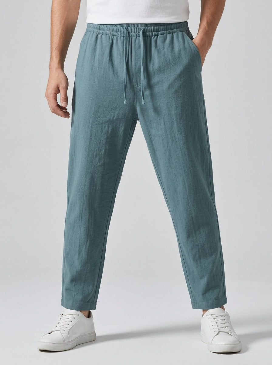 Men's light brown relaxed-fit linen trousers with drawstring
