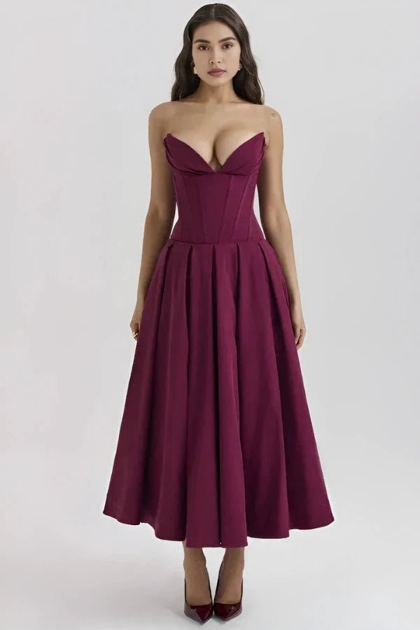 Women's pink corset midi dress with a structured bodice and full skirt