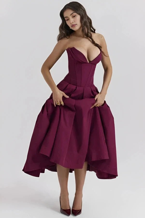 Women's pink corset midi dress with a structured bodice and full skirt