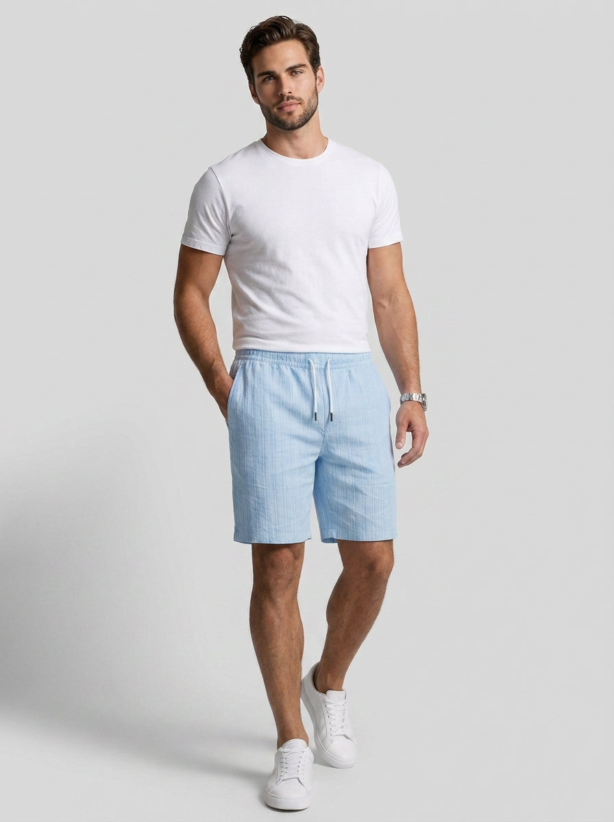 Men's white linen shorts with elastic waist and drawstring