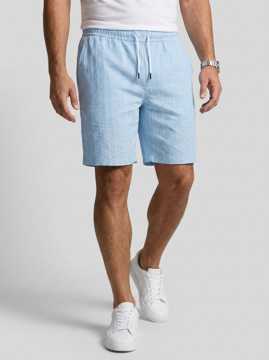 Men's white linen shorts with elastic waist and drawstring