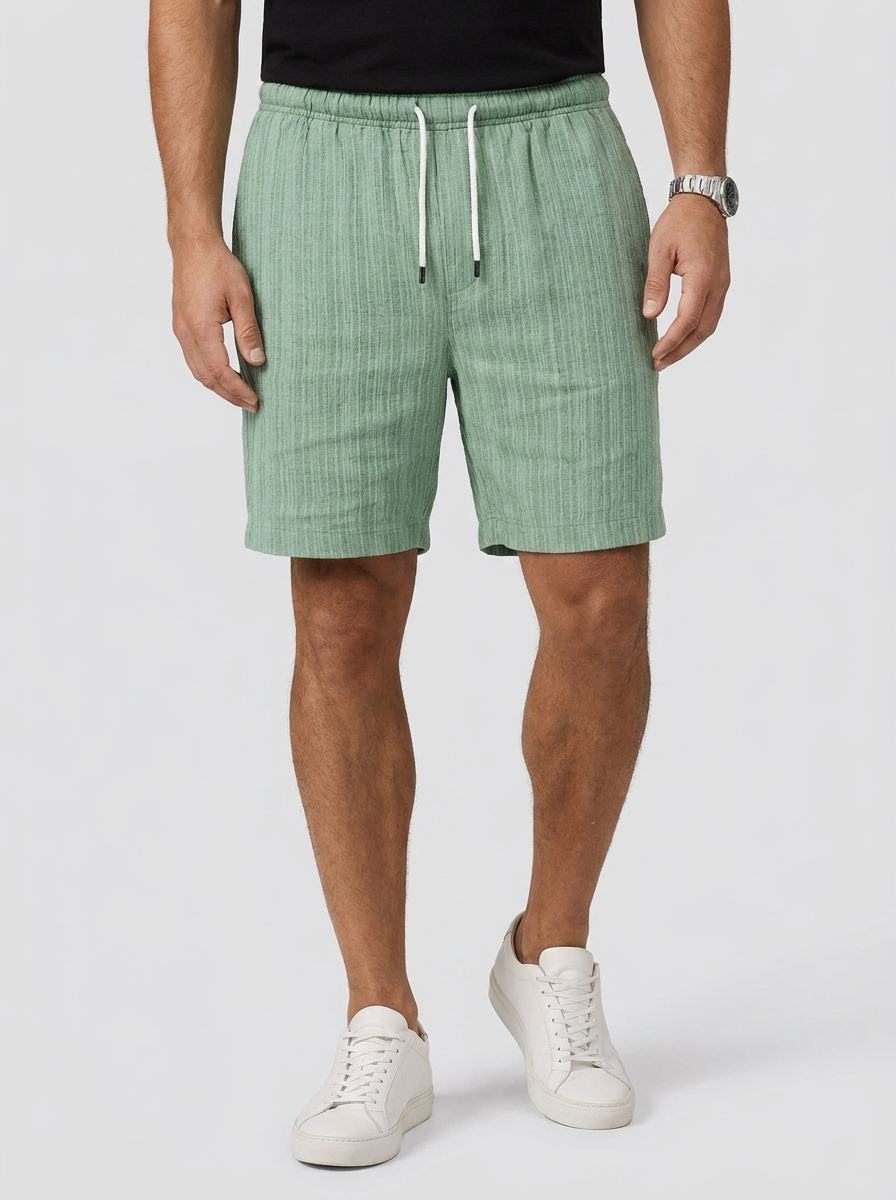 Men's white linen shorts with elastic waist and drawstring