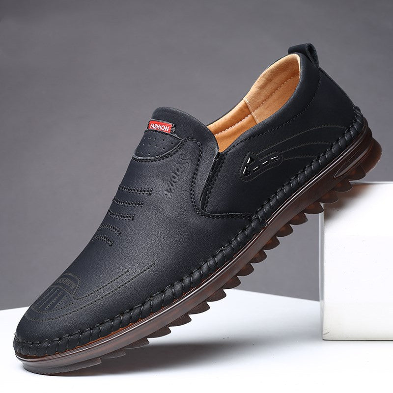 Men's black slip on leather loafers with moccasin stitch detail