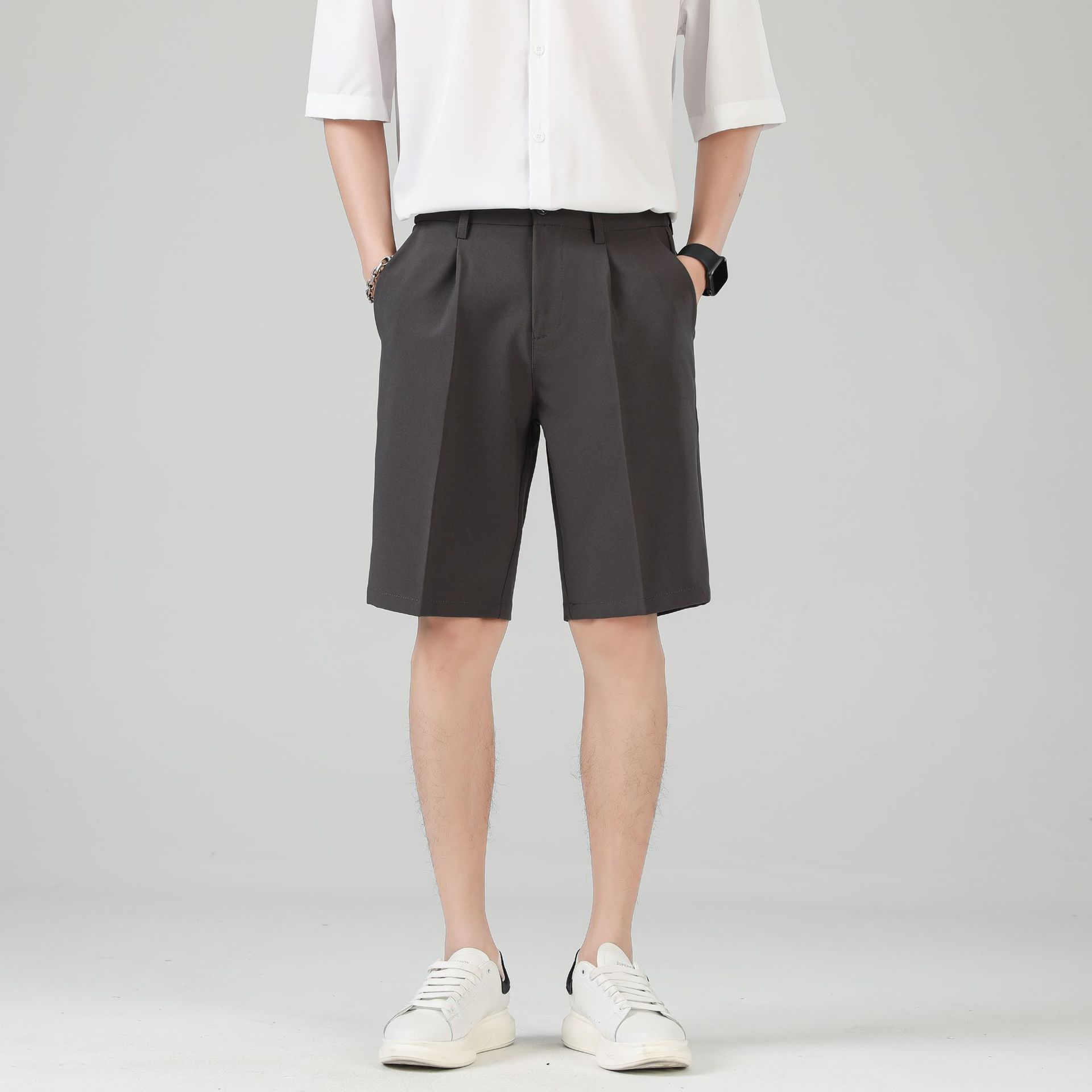 Men's black tailored chino shorts with double pleats and turn up hem