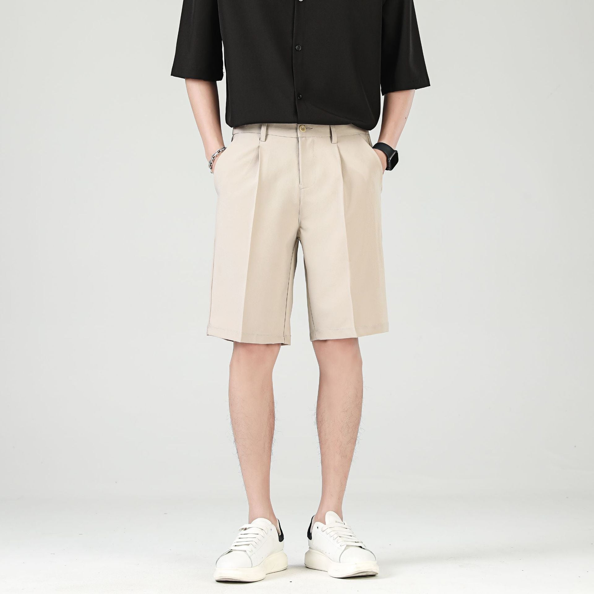 Men's black tailored chino shorts with double pleats and turn up hem