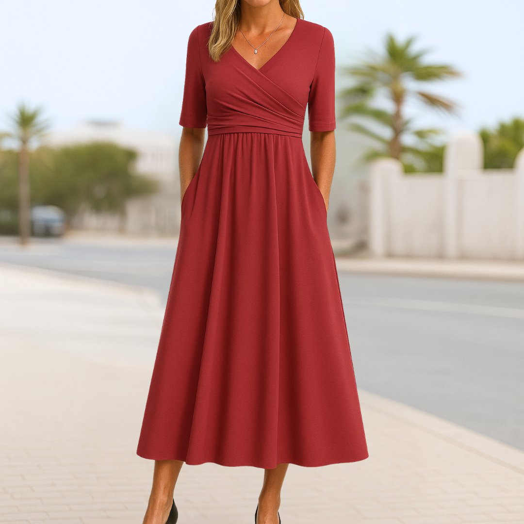 Women's navy blue wrap-style midi dress with cross front and short sleeves