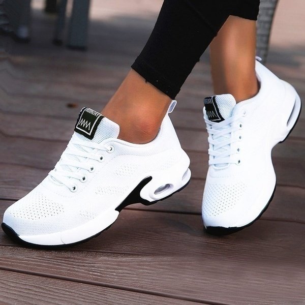 Women's black mesh walking trainers with cushioned sole and lace-up fit