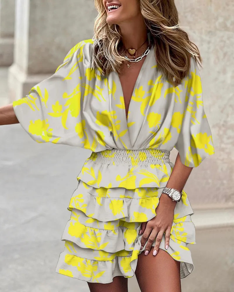 Women's yellow boho ruffle mini dress with a printed design