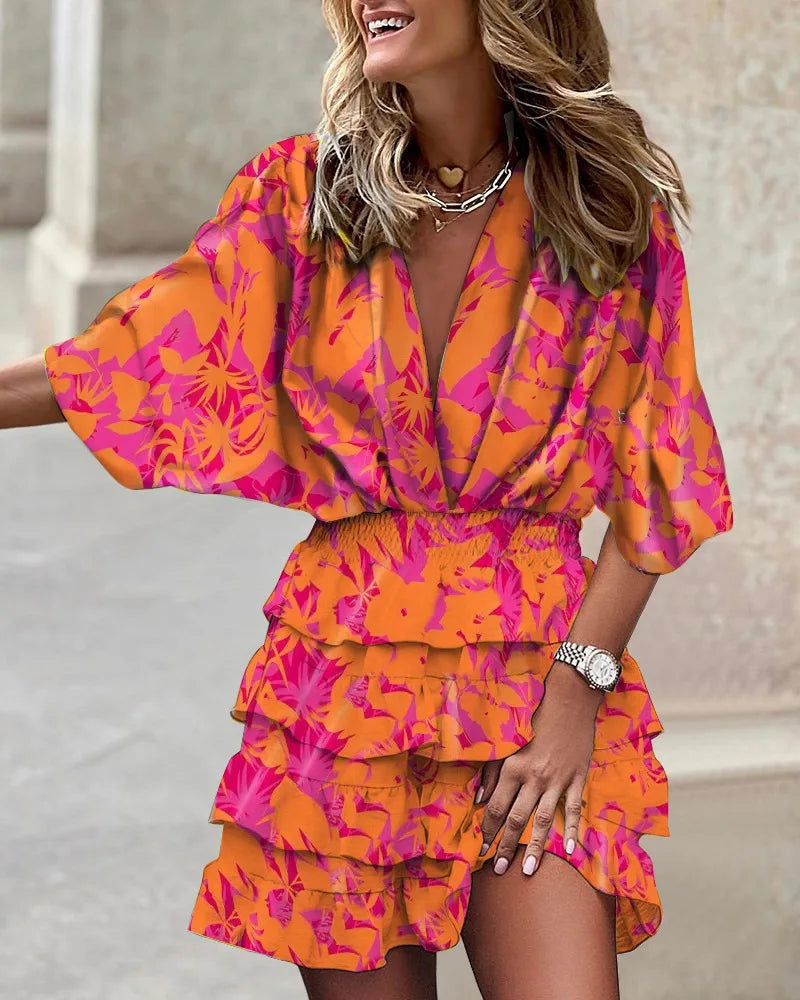 Women's yellow boho ruffle mini dress with a printed design