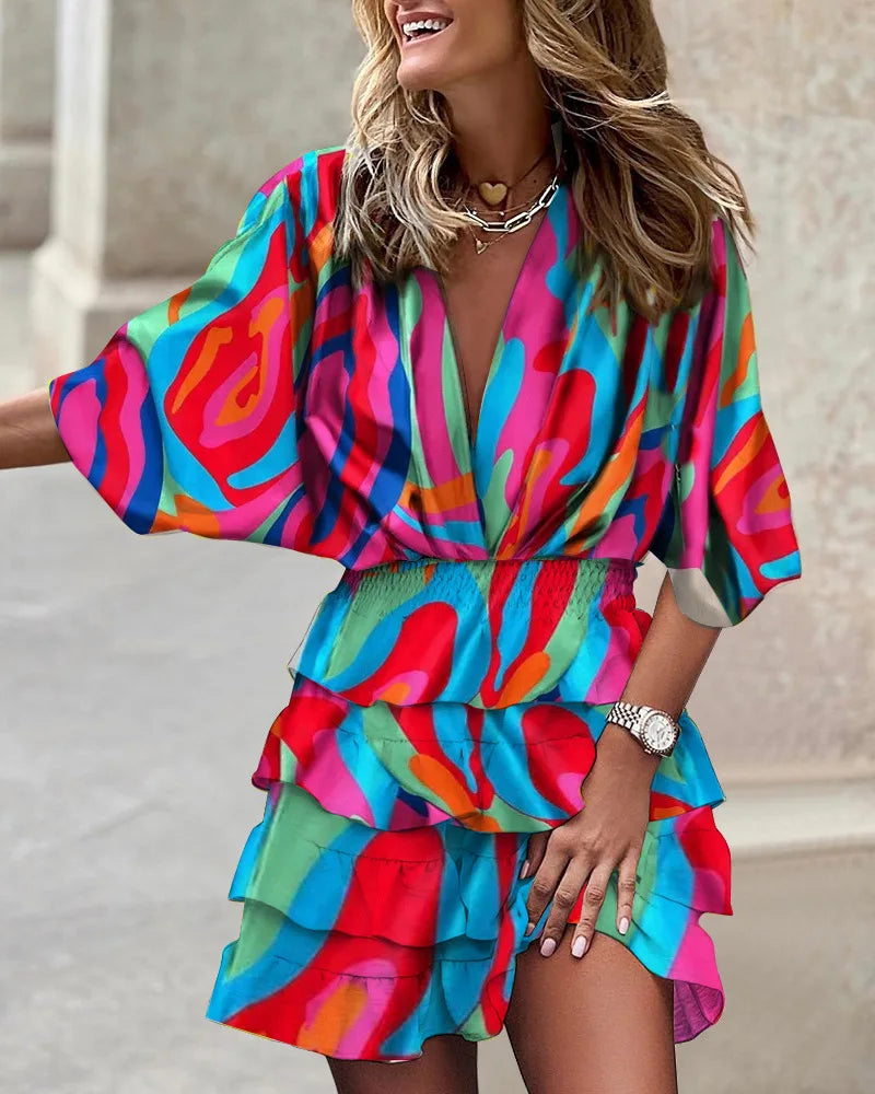 Women's yellow boho ruffle mini dress with a printed design