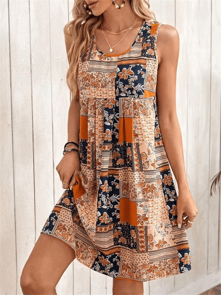 Women's orange sleeveless mini shift dress with a patchwork print