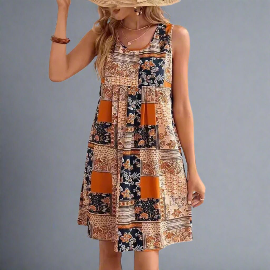 Women's orange sleeveless mini shift dress with a patchwork print