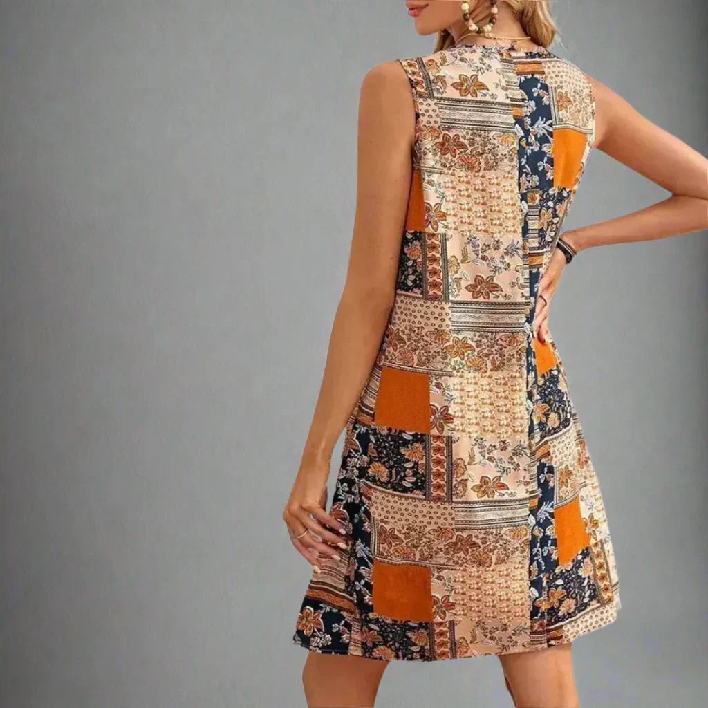Women's orange sleeveless mini shift dress with a patchwork print