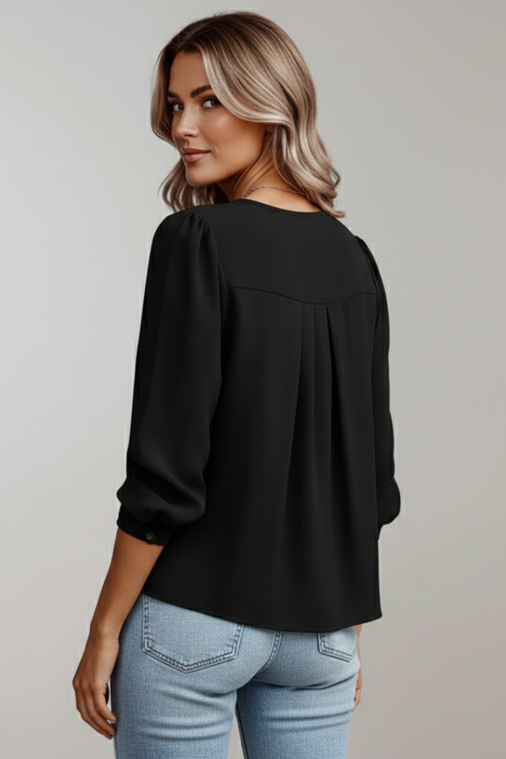 Women's black puff sleeve blouse with pleated front
