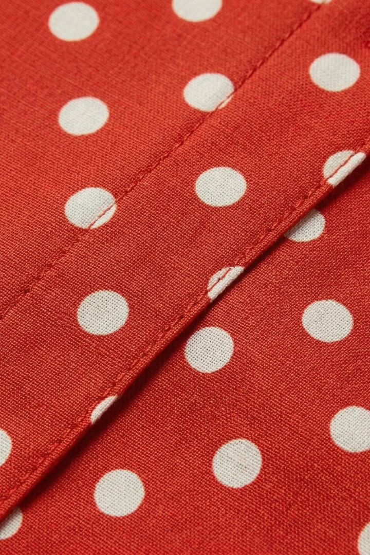 Women's white polka dot tea dress with V-neck and flared skirt
