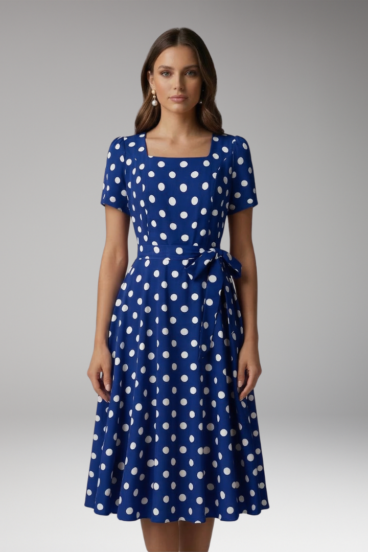 Women's white polka dot tea dress with V-neck and flared skirt