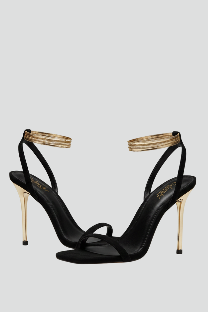 Women's black strappy stiletto heel sandals with wrap-around ankle strap