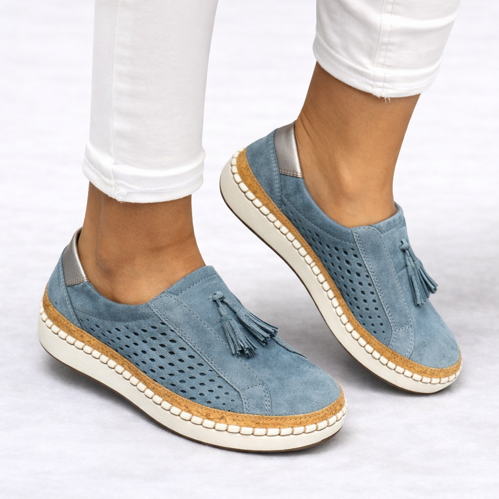 Women's green slip-on tassel loafers with perforated panels