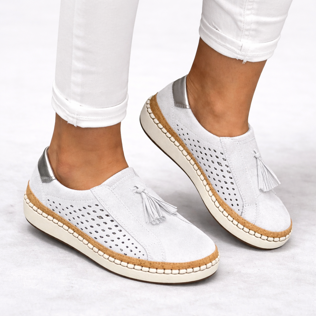 Women's green slip-on tassel loafers with perforated panels