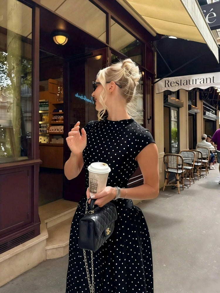 Women's black polka dot maxi dress with cap sleeves and high neck