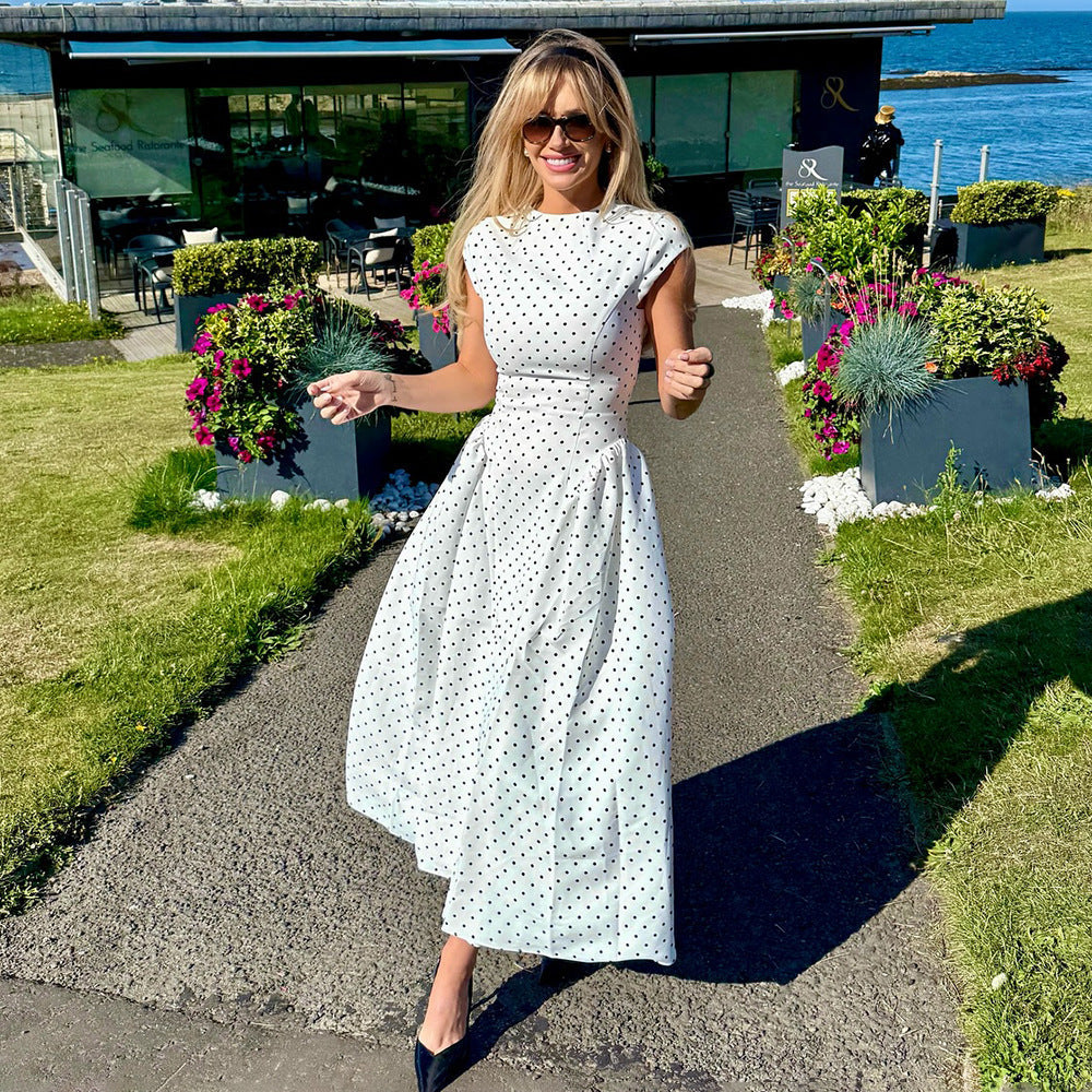 Women's black polka dot maxi dress with cap sleeves and high neck