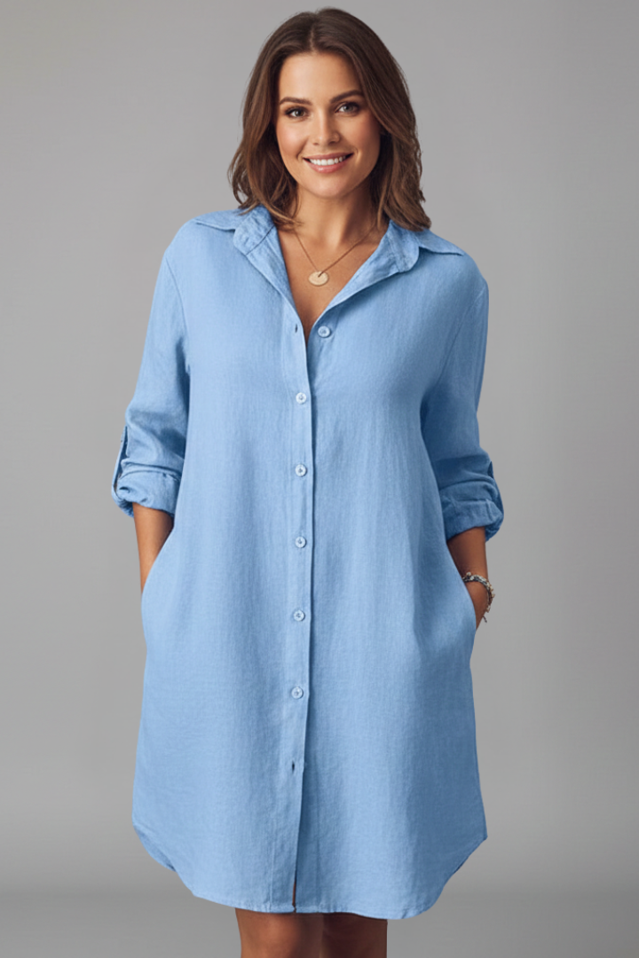 Women's blue button-through shirt dress with collar and side pockets