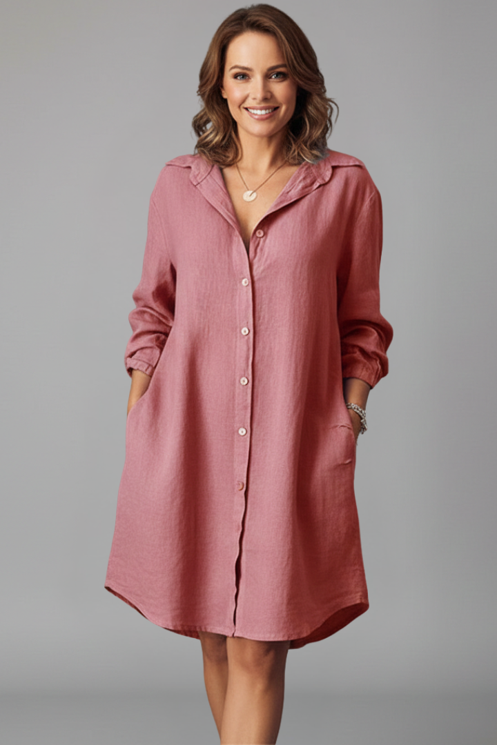 Women's blue button-through shirt dress with collar and side pockets