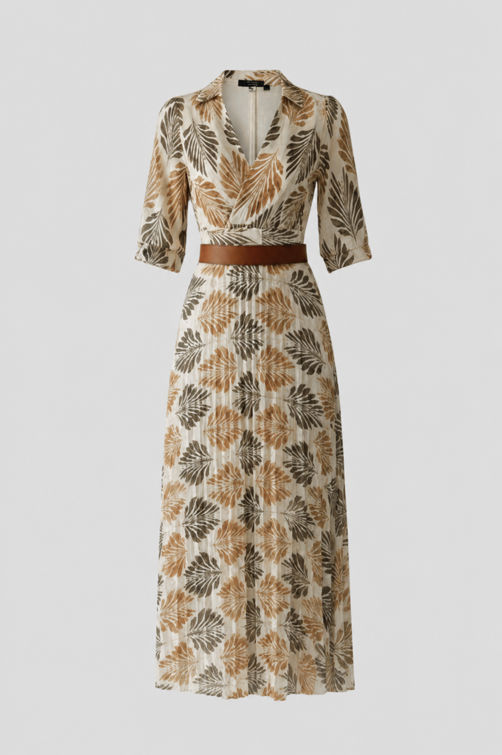 Patterned dress with a belt on a light gray background