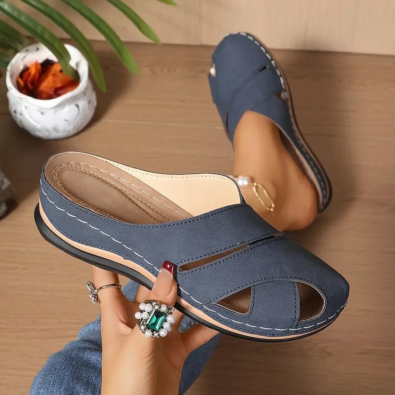 Women's black slip-on mule sandals with cushioned sole and open toe