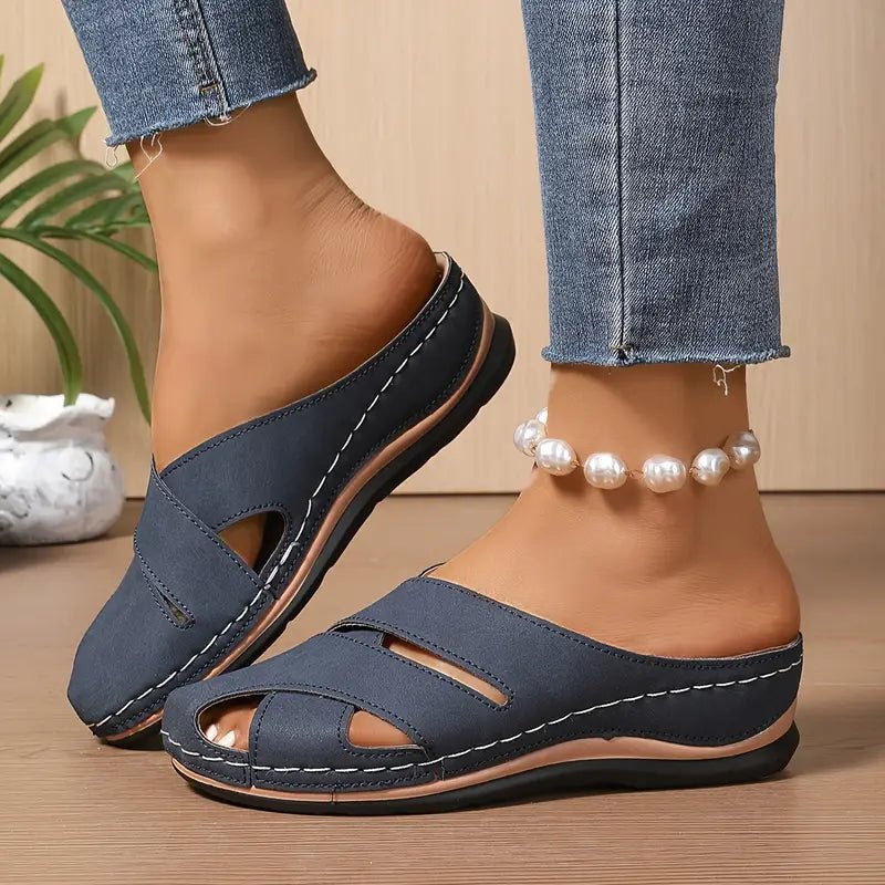 Women's black slip-on mule sandals with cushioned sole and open toe