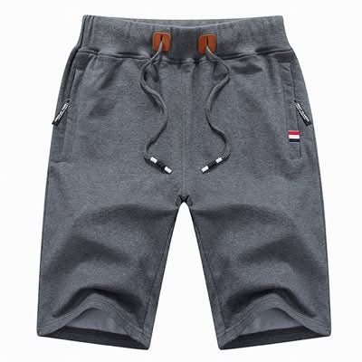 Men's white knee-length jersey shorts with zip pockets