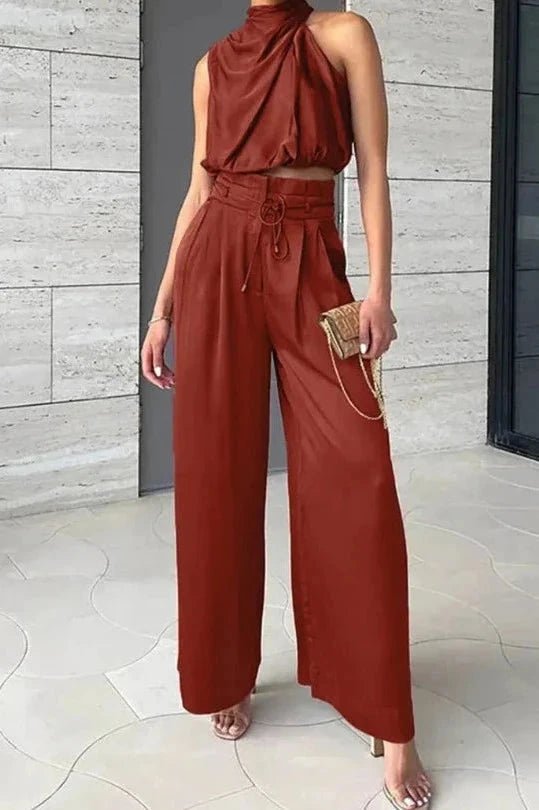 Women's black two piece co-ord set with a v-neck top and wide-leg trousers