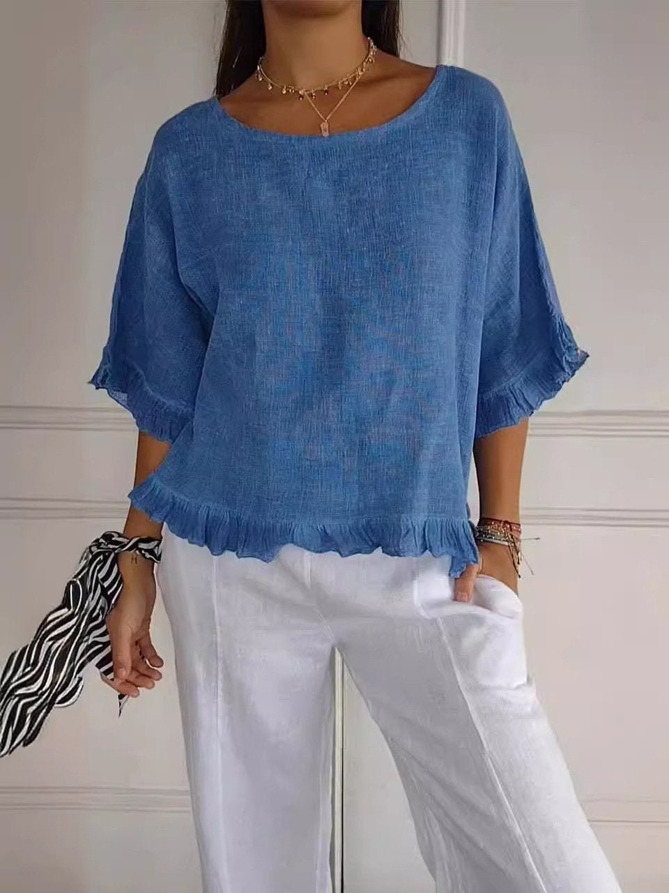 Women's blue frayed edge blouse with three-quarter sleeves