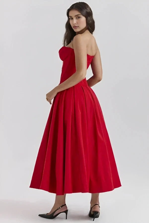 Women's pink corset midi dress with a structured bodice and full skirt