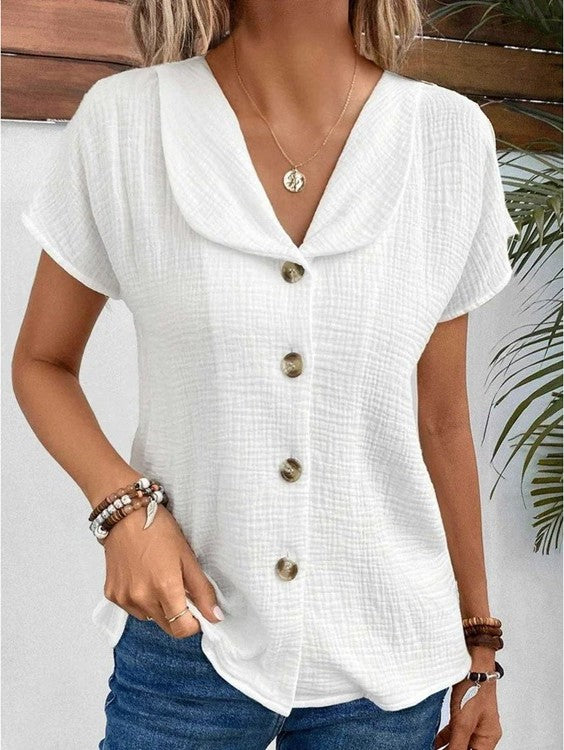 Women's white collared button-up blouse in textured fabric