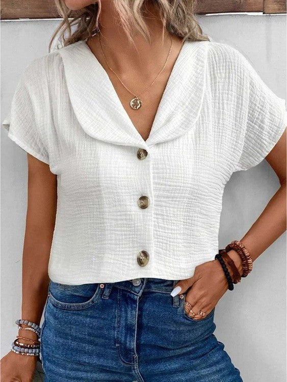 Women's white collared button-up blouse in textured fabric