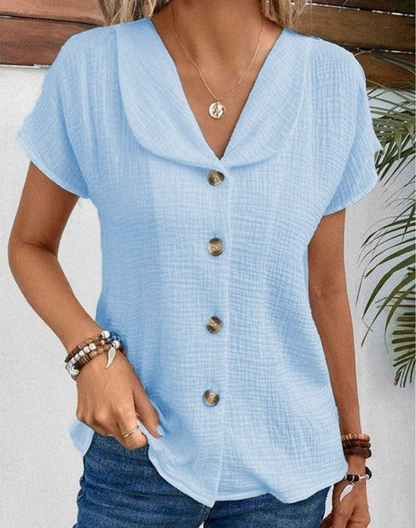 Women's white collared button-up blouse in textured fabric