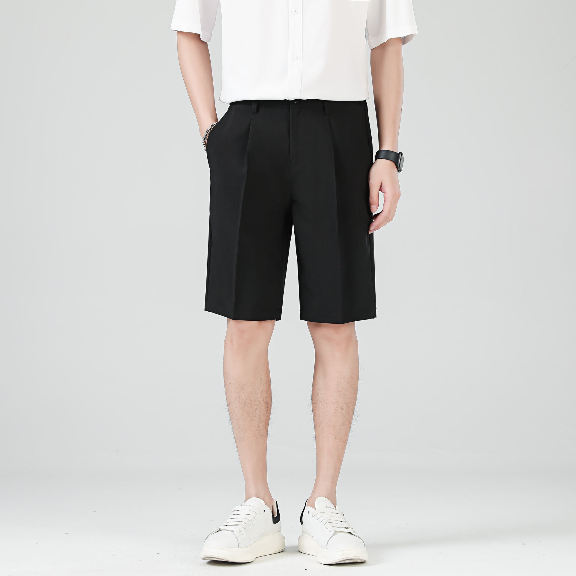 Men's black tailored chino shorts with double pleats and turn up hem