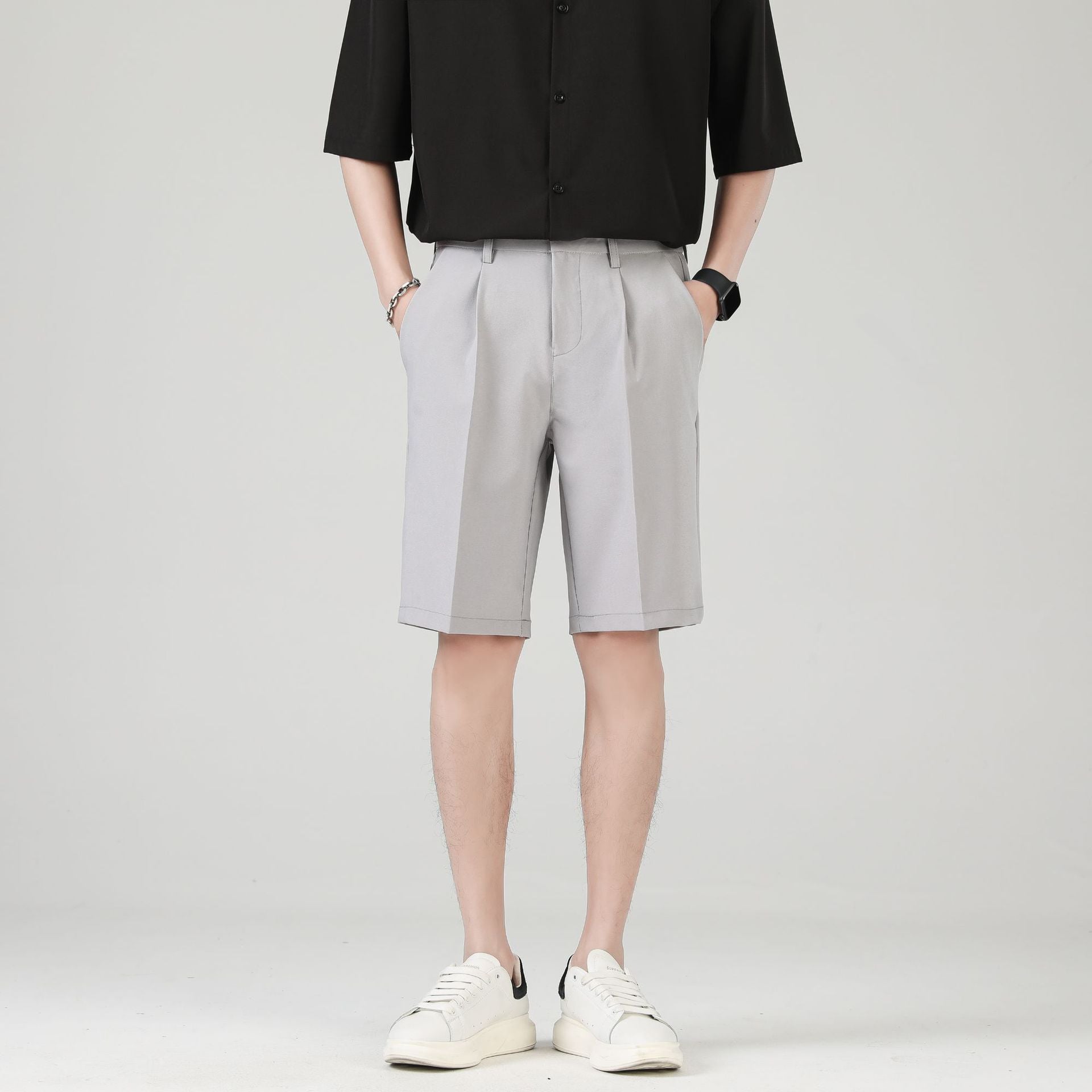 Men's black tailored chino shorts with double pleats and turn up hem