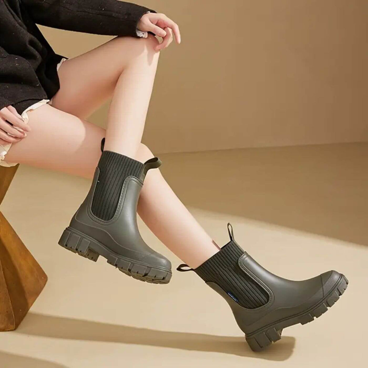 Women's heeled ankle boots in black, green, orange, pink and white