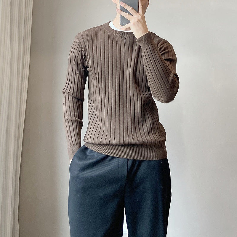 Brown Crew Neck Jumper worn with the sleeves pushed up neatly