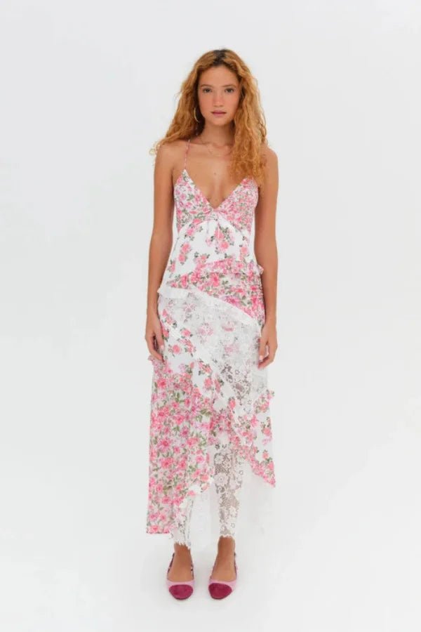 Women's pink floral maxi dress with a plunging neckline and ruffles