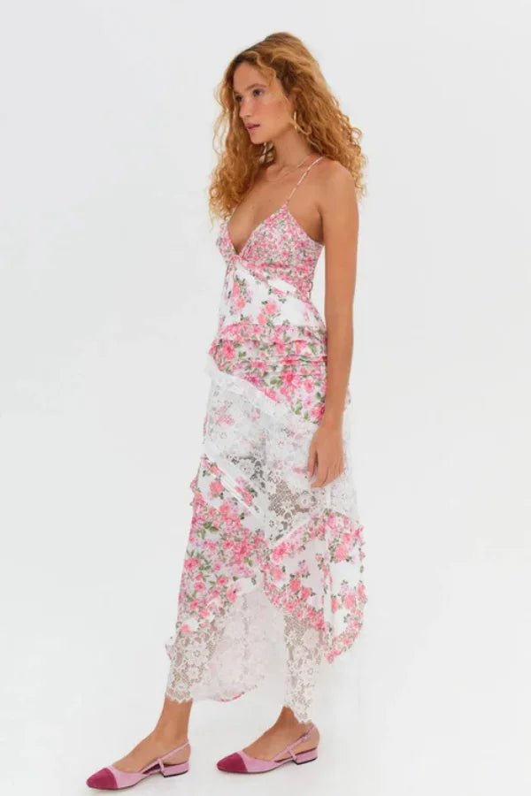 Women's pink floral maxi dress with a plunging neckline and ruffles