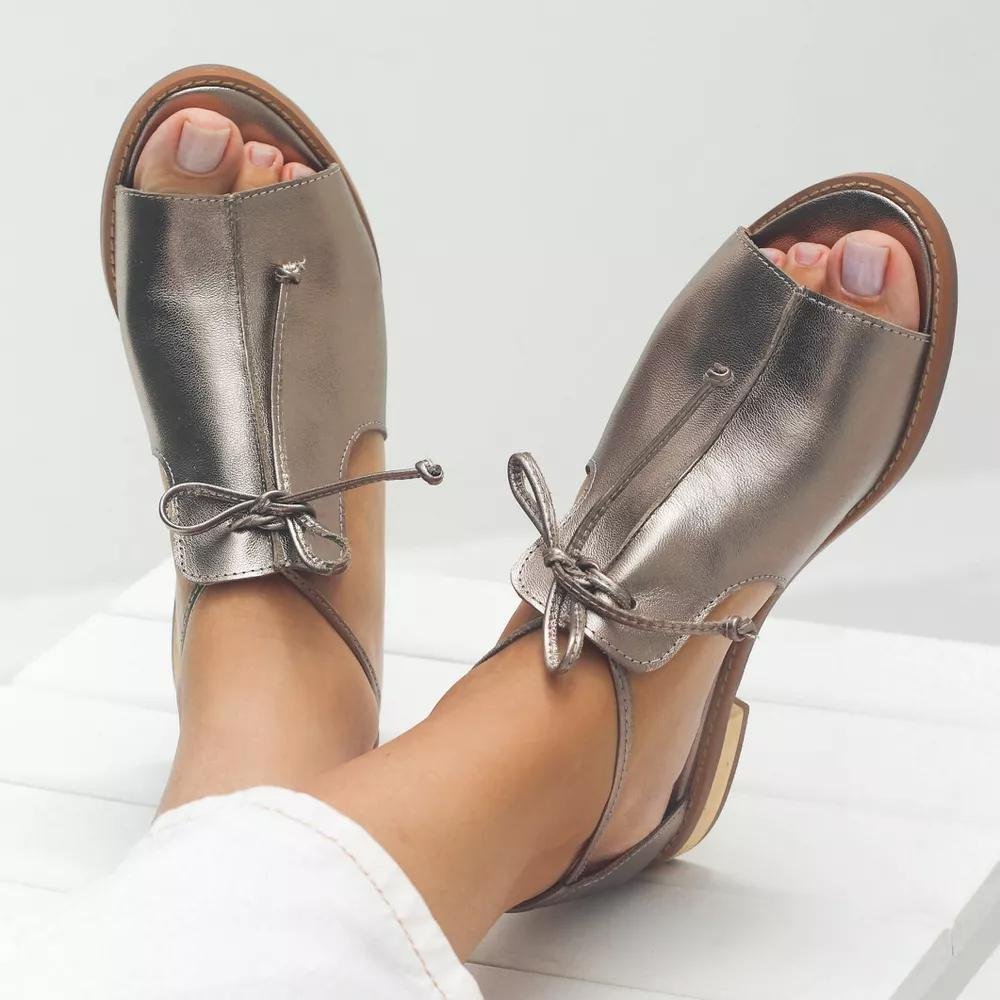 Women's silver metallic flat sandals with bow tie straps and open toe